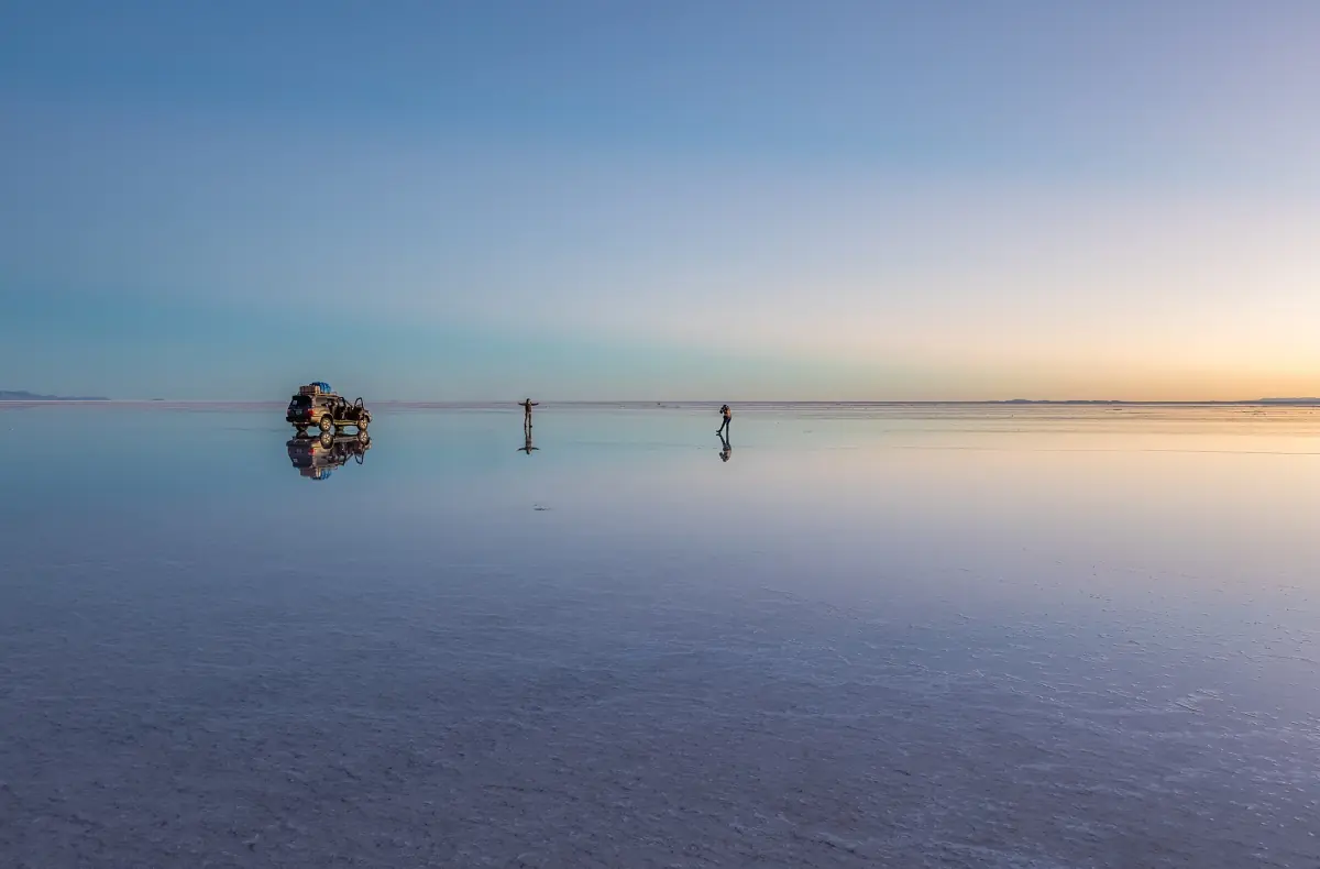 The Uyuni Salt Flat reflecting the sky at sunrise