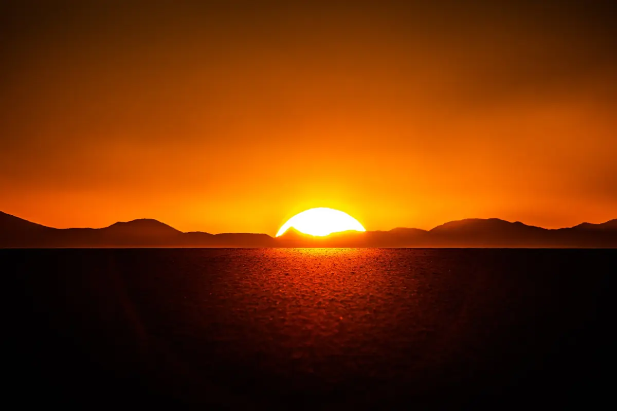 The sun setting over the salt flat